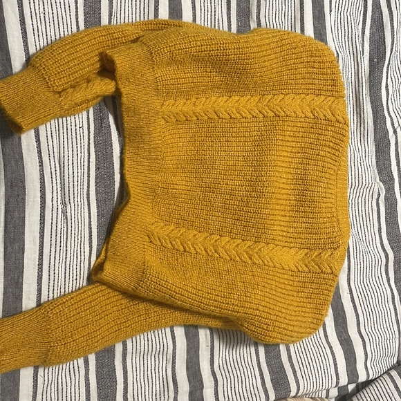 The color of the cardigan is yellow with buttons down the middle. - Picture 7 of 7